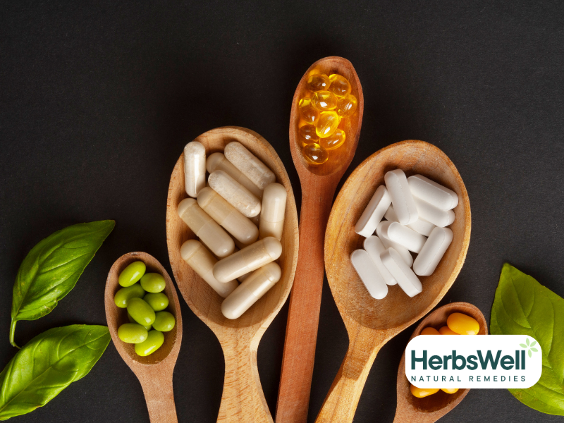 Herbal supplements on 5 wooden spoons. 